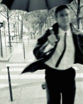 Businessman Running with Umbrella