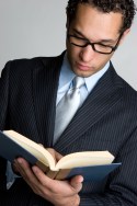 bigstock-Businessman-Reading-Book-4821928