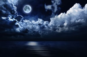 full-moon-in-night-sky-over-water